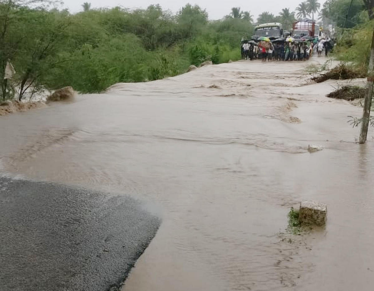 A stream overflowed affecting road connectivity at Gojanuru village in Lakshmeshwar, of Gadag district.
