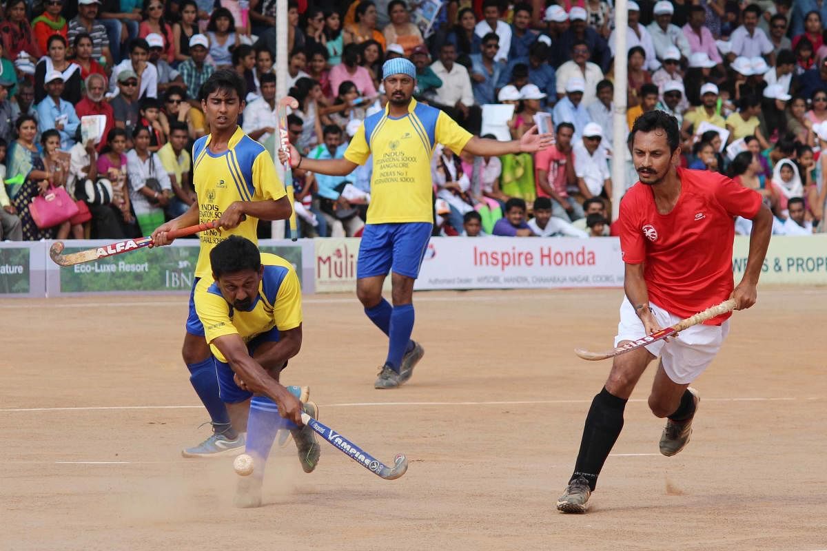 Aiming for a Goal: A match in progress during the Kodava Hockey Festival 2016 in Madikeri, Kodagu. Photos by DH, Niran Shantheyanda