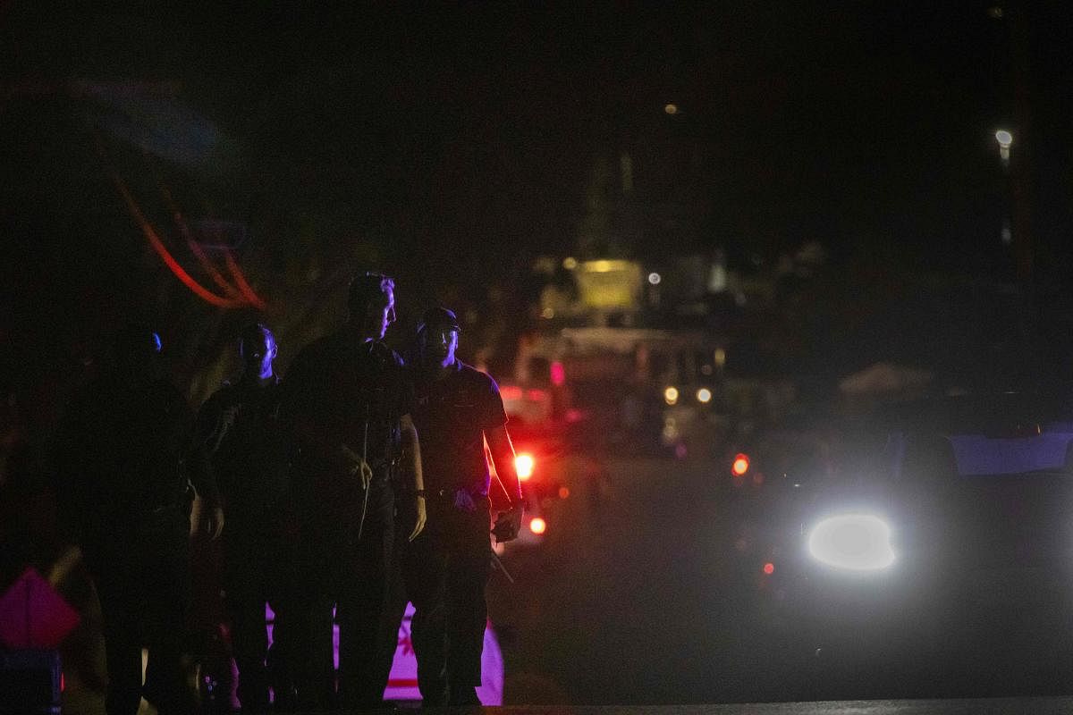 Police officers leave the scene of the investigation following a deadly shooting at the Gilroy Garlic Festival in Gilroy, 80 miles south of San Francisco, California on July 28, 2019. (Photo by AFP)