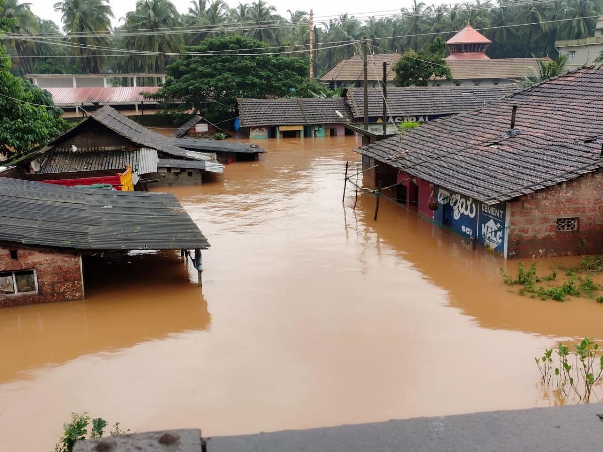 Houses submerged in flood-hit Panemangaluru on Saturday.
