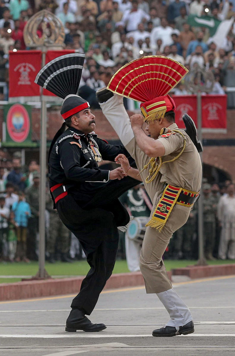 A file photo of Border Security Force and Pakistani Rangers personnel taking part in the beating retreat ceremony at the India-Pakistan Attari-Wagah border on the eve of Independence Day. PTI Photo