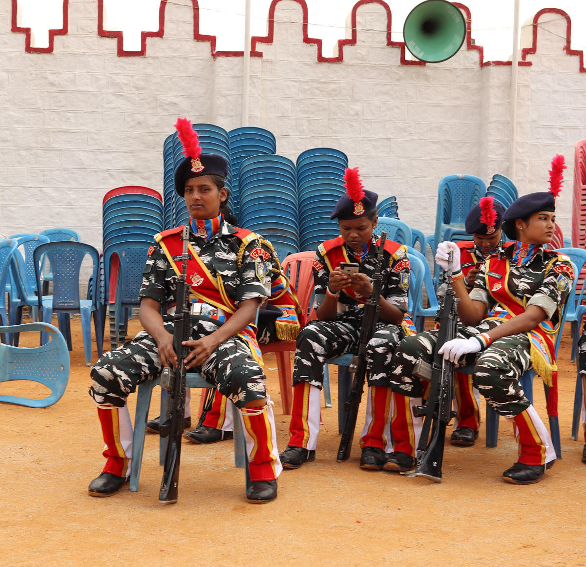 Members of the Central Police Reserve Force rest after parading during the Independence Day parade at Field Marshal Manekshaw Parade grounds in Bengaluru on August 15, 2019.