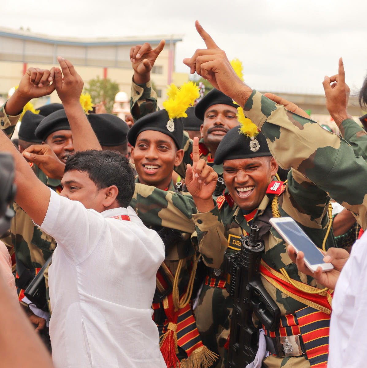 Members of Border Security Force celebrate after winning a trophy for best march-past during the Independence Day celebrations at Field Marshal Manekshaw Parade grounds in Bengaluru on August 15, 2019.