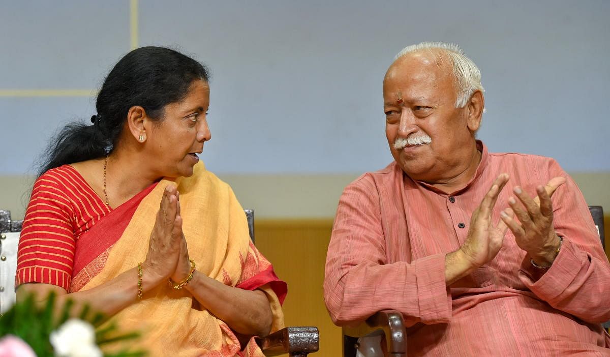 Finance Minister Nirmala Sitharaman and RSS chief Mohan Bhagwat at a function in New Delhi. PTI 