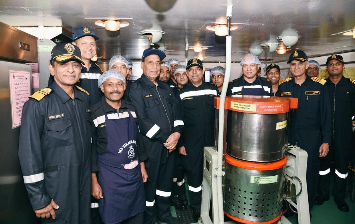 Defence Minister Rajnath with Navy crew.