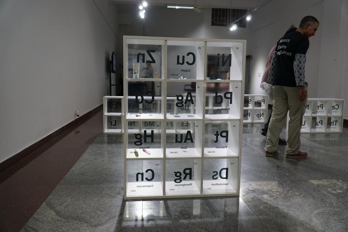 An exhibit titled BYOE (bring Your Own Element) encouraged visitors to contribute items to various display boxes assigned to the various elements.