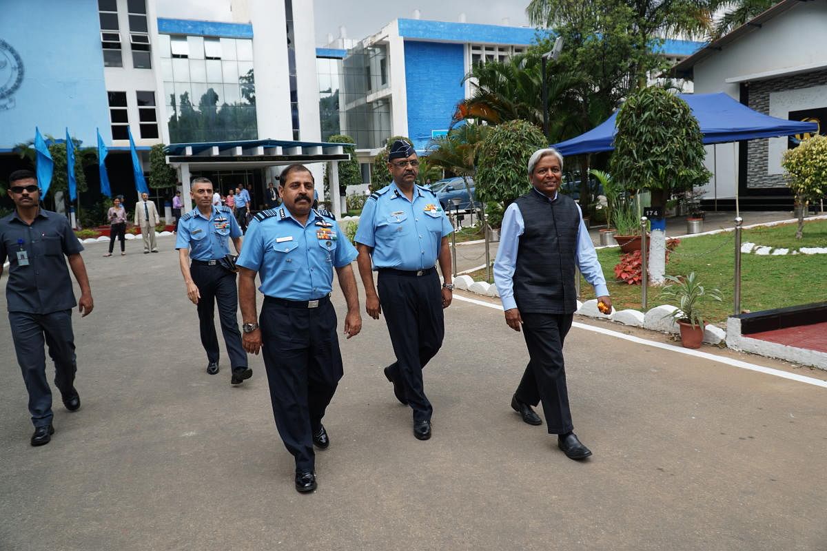 Air Chief Marshal R K S Bhadauria (left, foreground), walks with Air Commodore Anupam Agarwal, commandant of the Institute of Indian Aviation Medicine and K VijayRaghavan, Principal Scientific Adviser for the Government of India on the grounds of Institut