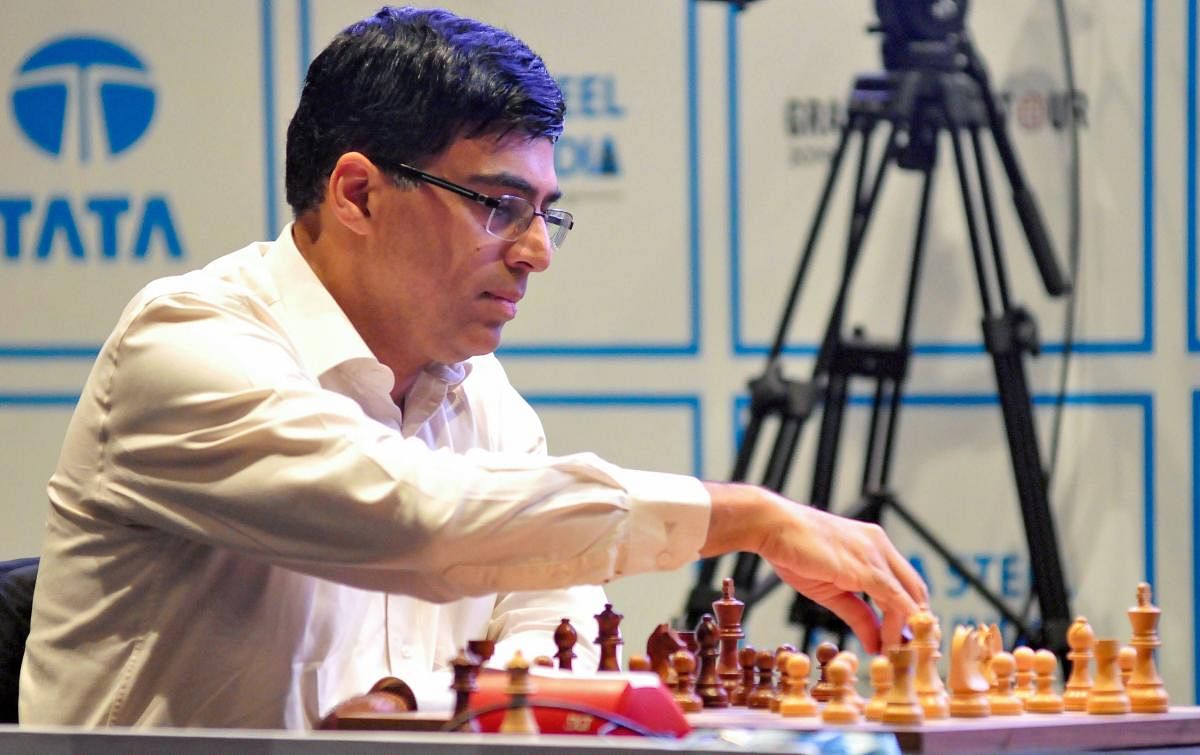 Five-time chess world champion Viswanathan Anand plays a move against Chinese Grandmaster Ding Liren(unseen) on the first day of 'Tata Steel Chess India 2019 - Rapid format', in Kolkata. Credit: PTI File Photo