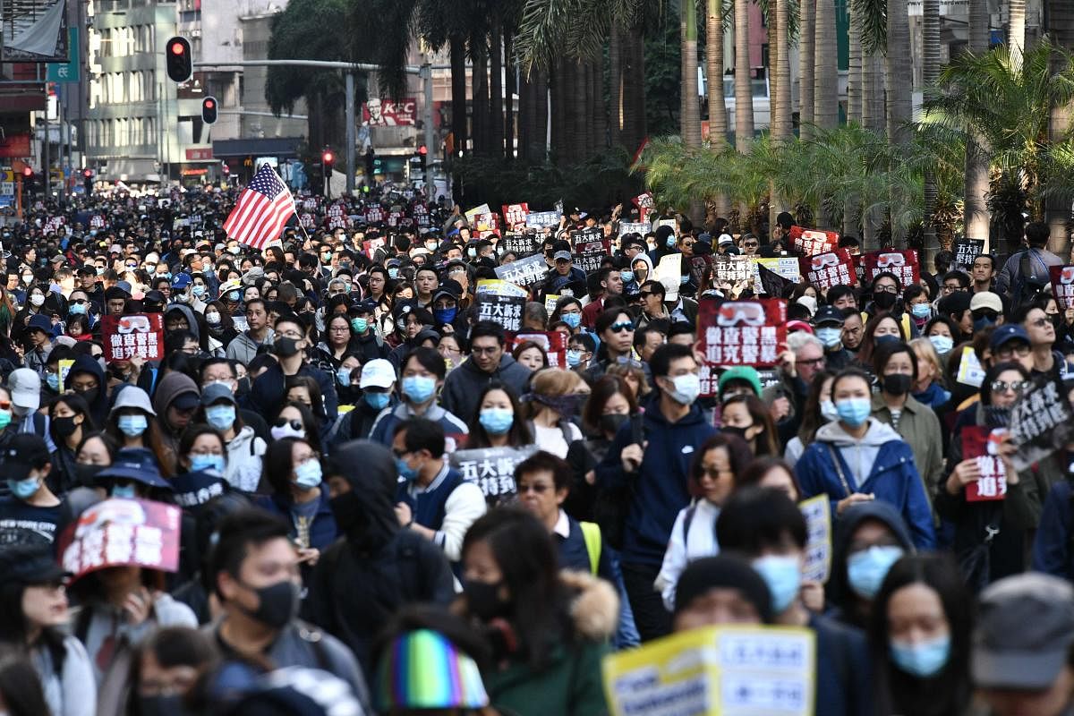 People take part in a pro-democracy rally from Victoria Park to Chater Road in Hong Kong on December 8, 2019. (Photo by AFP)
