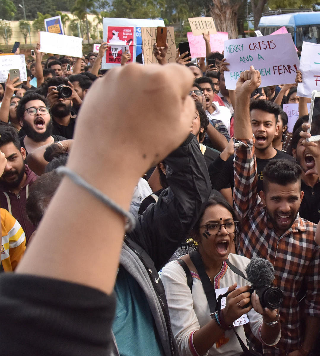 Students march during a protest against the CAA at Freedom Park on Tuesday. DH PHOTO/JANARDHAN B K