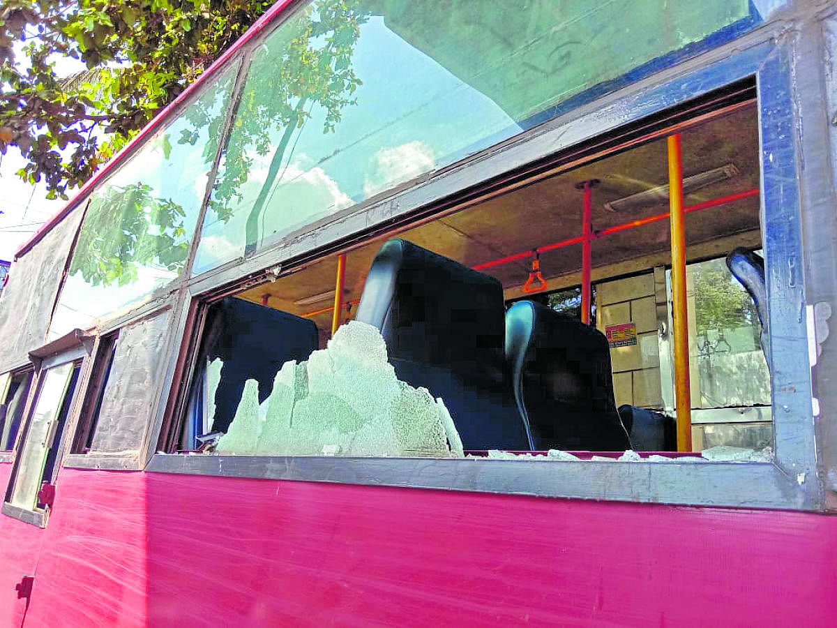 A NWKRTC bus damaged in the stone pelting after a few protesters went berserk in Belagavi on Tuesday.