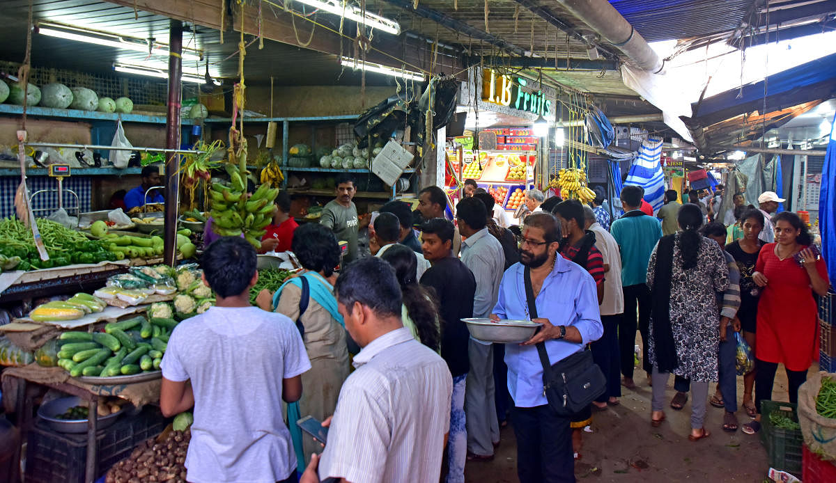 People rushed to buy essentials after the curfew was relaxed in Mangaluru on Saturday. dh photo/Govindraj Javali