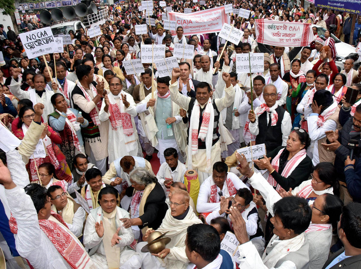 Sonitpur: Protestors hold placards and raise slogans during a demonstration against the Citizenship Amendment Act (CAA) and NRC, in Sonitpur district, Sunday, Dec. 22, 2019. (PTI Photo)