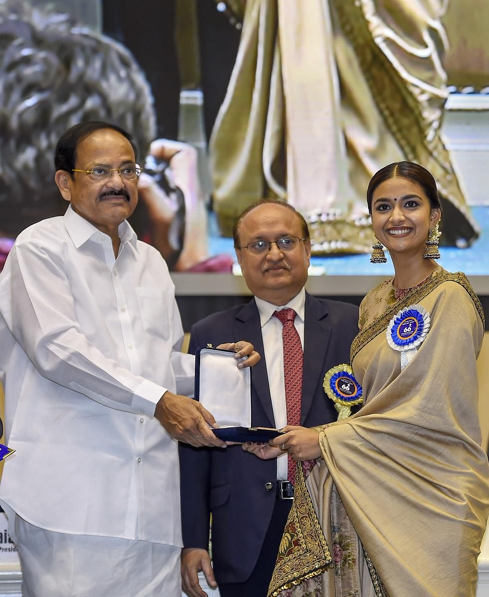 Vice President M Venkaiah Naidu presents Best Actress award to actress Keerthy Suresh for her role in Mahanati during the 66th National Film Awards function at Vigyan Bhavan in New Delhi, Monday, Dec. 23, 2019. (PTI Photo)