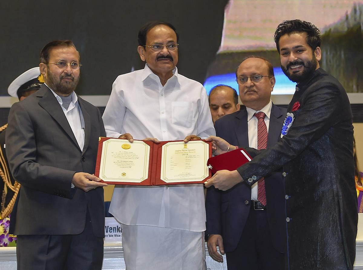 Vice President M Venkaiah Naidu presents the award for Best Direction to Aditya Dhar for the film