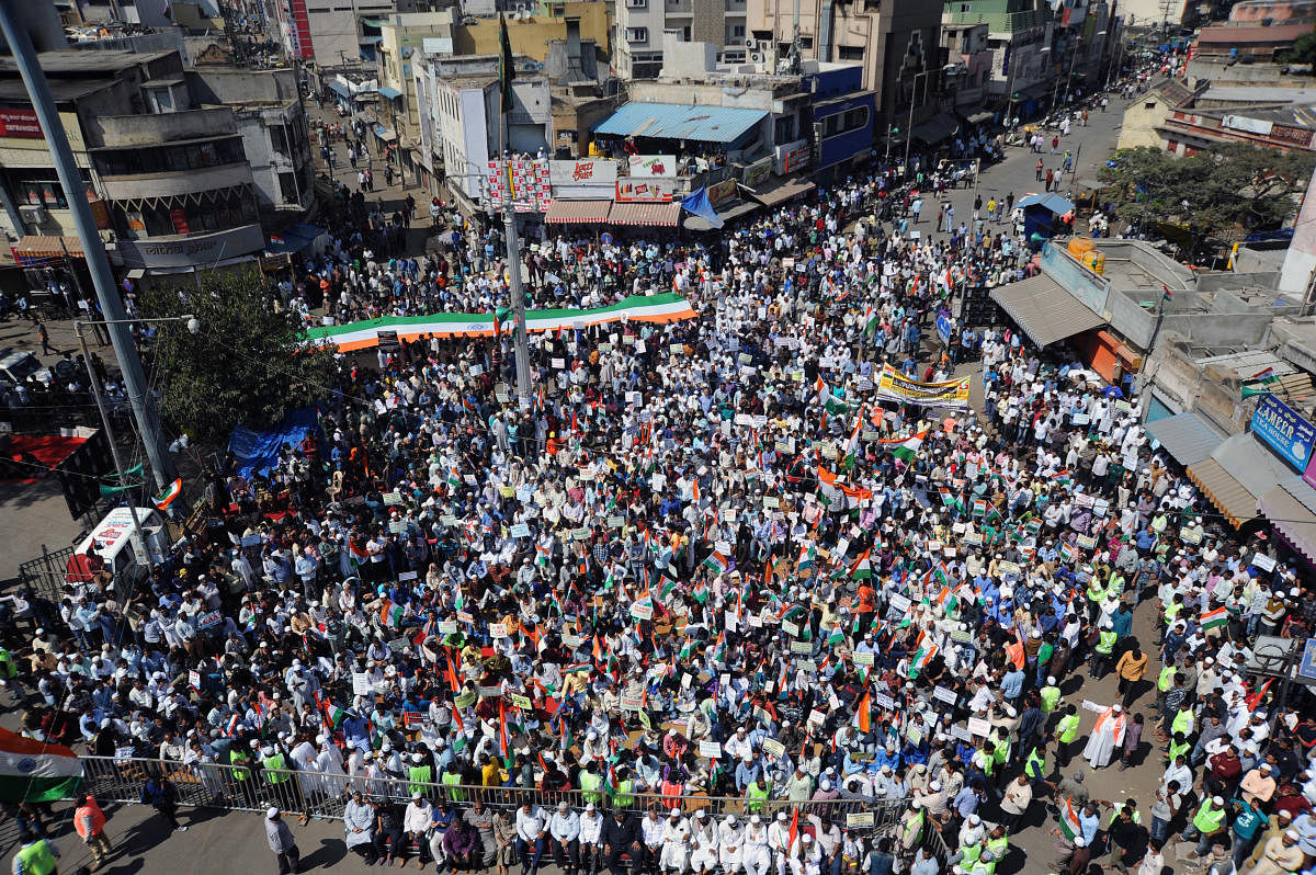 People gather at Chandni Chowk in Shivajinagar to protest against the Citizenship (Amendment) Act on Tuesday. DH PHOTO/PUSHKAR V