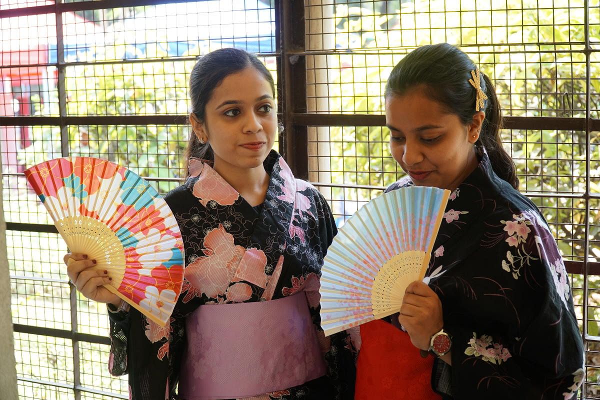 Shubhangi, 22 an IT professional, (on left) tries on a Kimono at Japan Habba. (NOTE - This individual mentioned in story.)