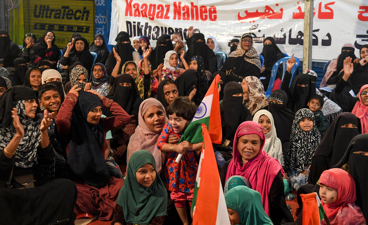Women and children during a sit-in protest against the CAA on Tannery Road on Sunday. DH PHOTO/B H SHIVAKUMAR