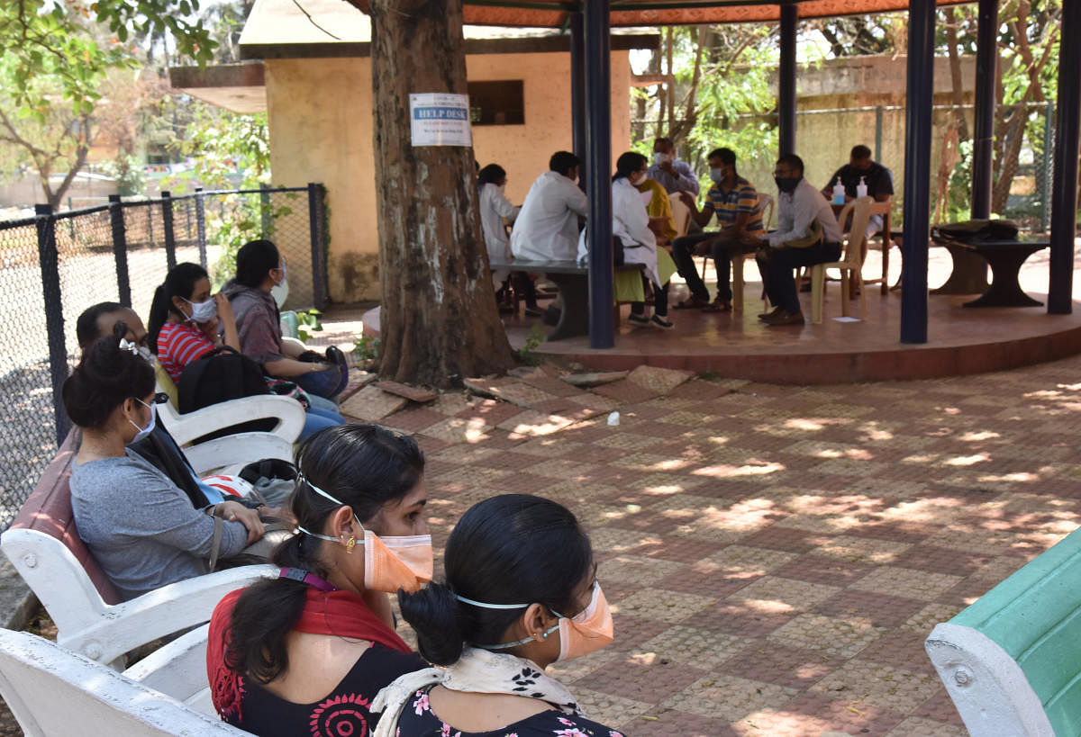 People waiting for Covid-19 screening at the outpatient department at the Rajiv Gandhi Institute of Chest Diseases, Bengaluru, on March 13, 2020. DH PHOTO/Janardhan B K