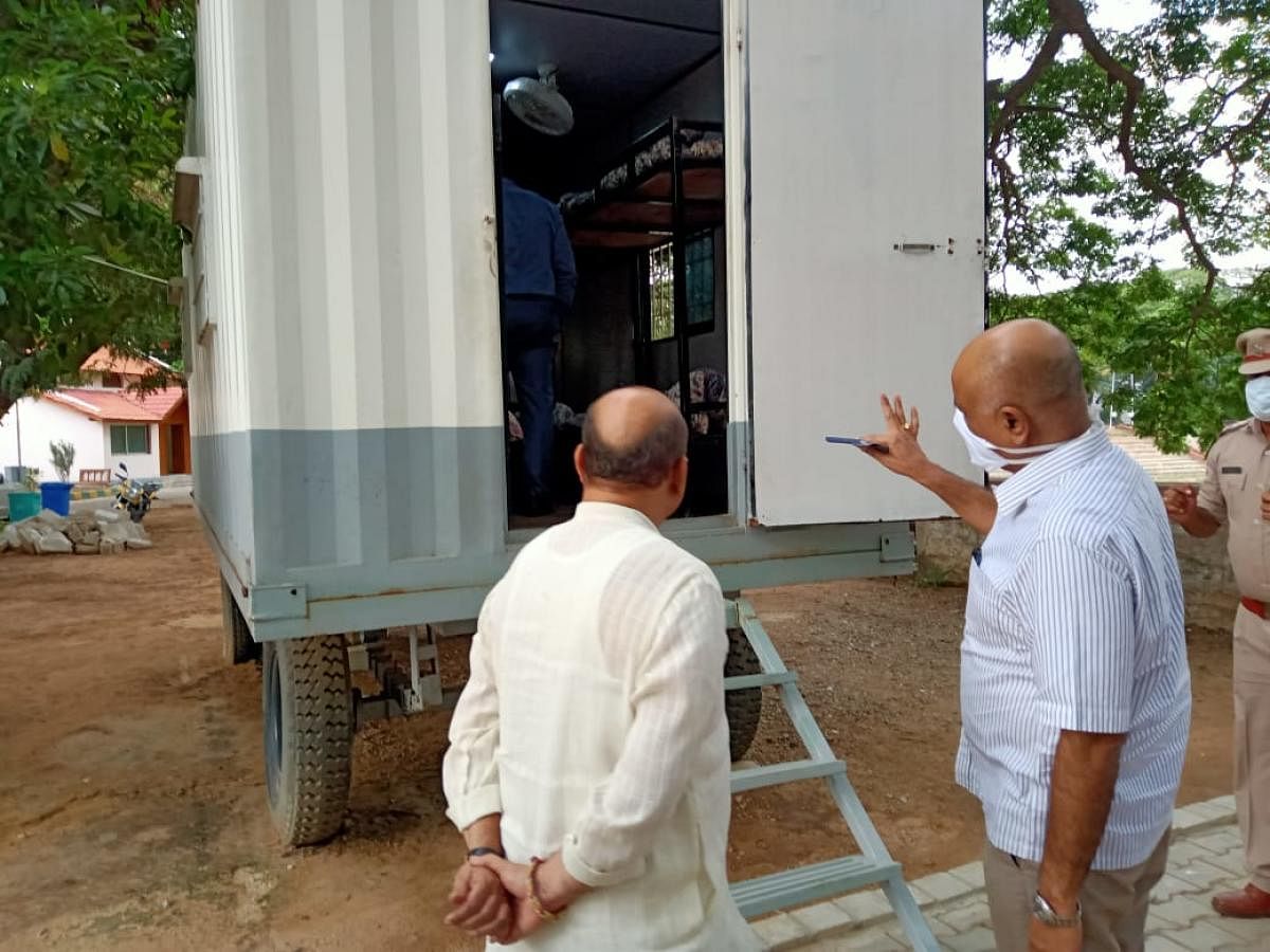 Home Minister Basavaraj Bommai inspects a model of the mobile resting unit to be set up at six checkposts in Karnataka. Special arrangement