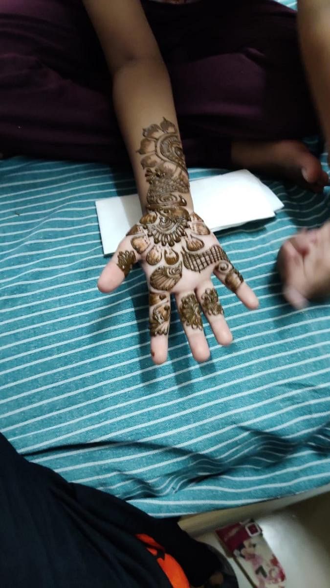 Women patients tried their hand at applying mehendi.SPECIAL ARRANGEMENT 
