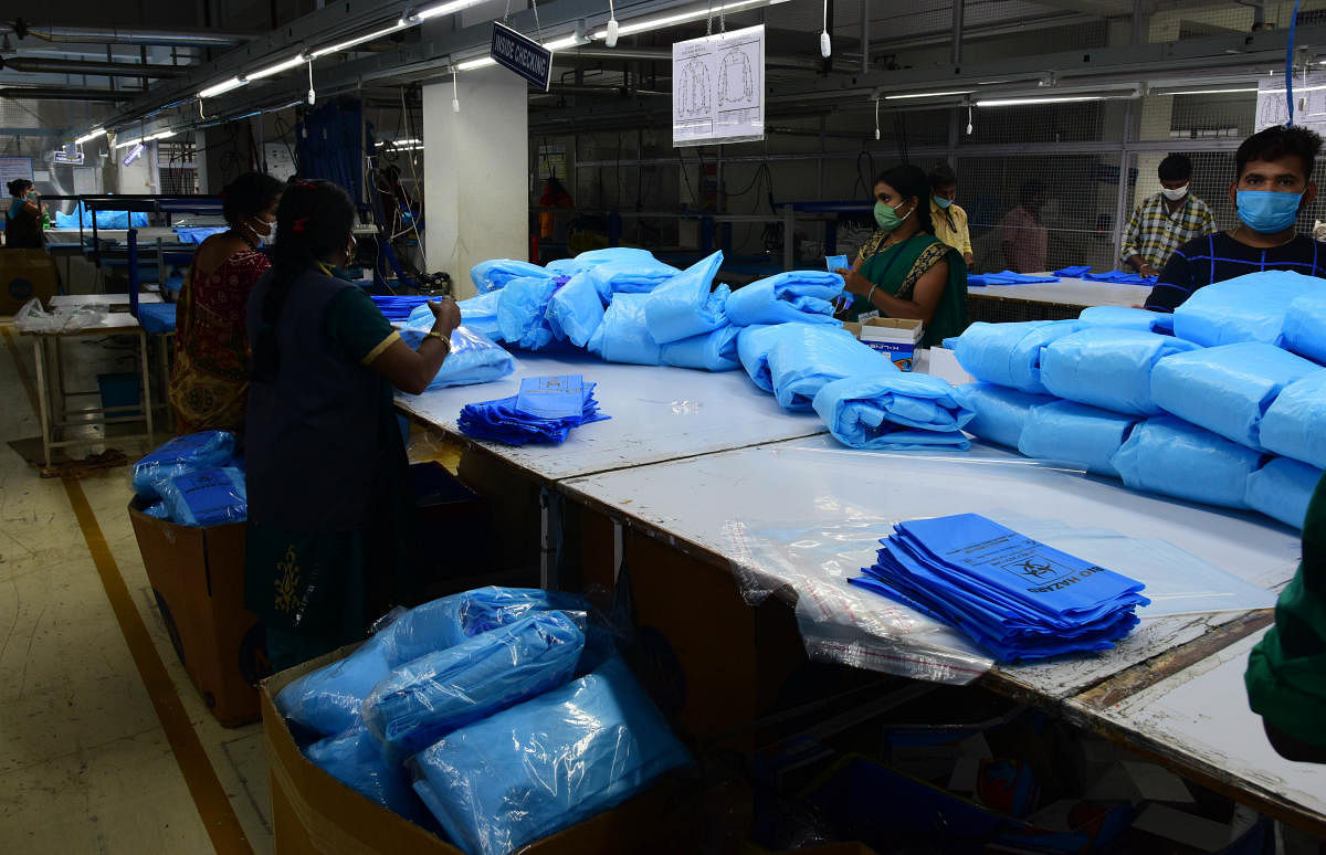 Garment factories in the Peenya Industrial Area produce nearly 1.25 lakh Personal Protective Equipment (PPE) of the 4.5 lakh manufactured in the country daily. DH PHTOS/B H SHIVAKUMAR
