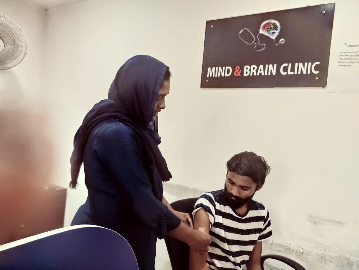 Dr Safiya MS, medical director of Mind & Brain Clinic, explaining to a patient about using a nicotine patch.