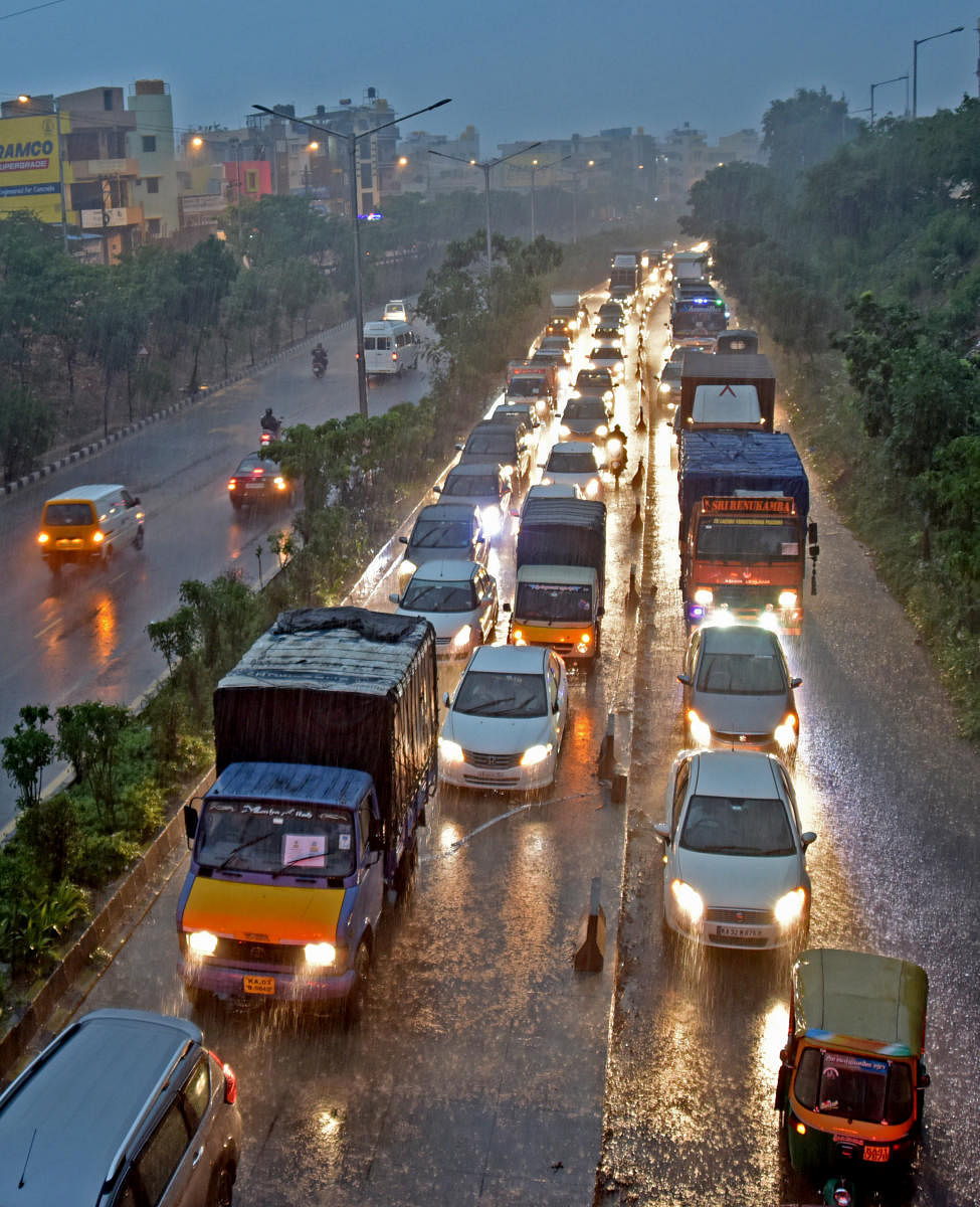 Slow-moving traffic at Nandini Layout, Outer Ring Road. DH photo/M S MANJUNATH