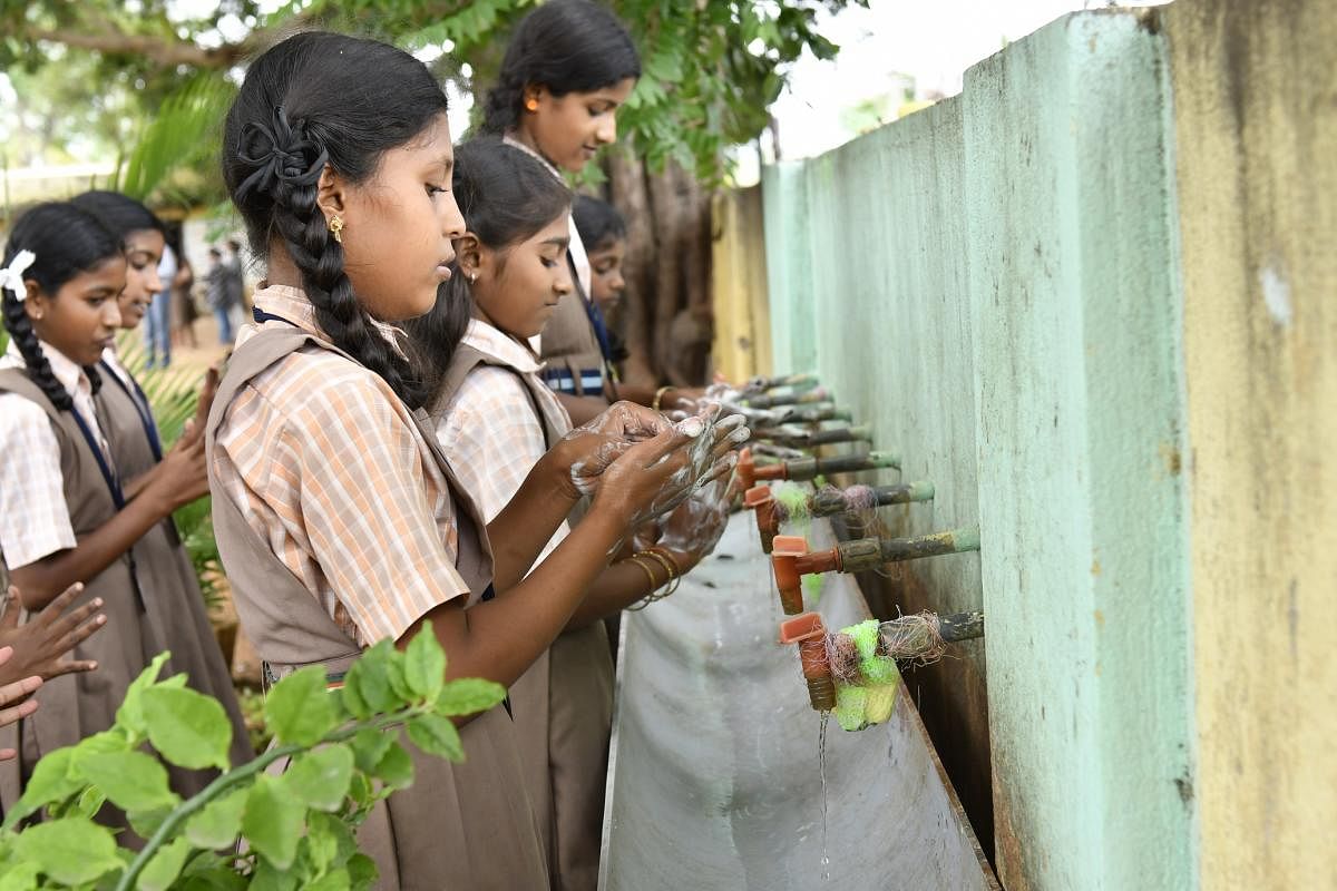 School children being educated about the importance of hygiene and sanitation 