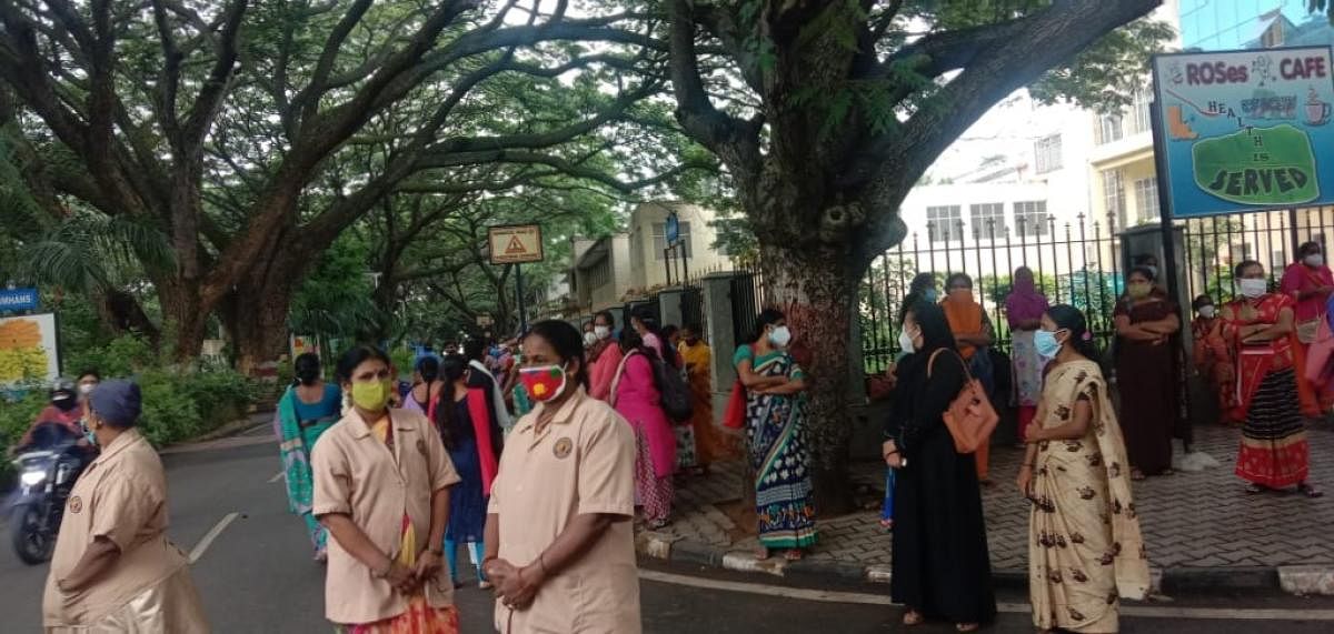 Contract workers at the Victoria Hospital and Nimhans protest against the alleged apathy of the hospital authorities on Monday. Special arrangement
