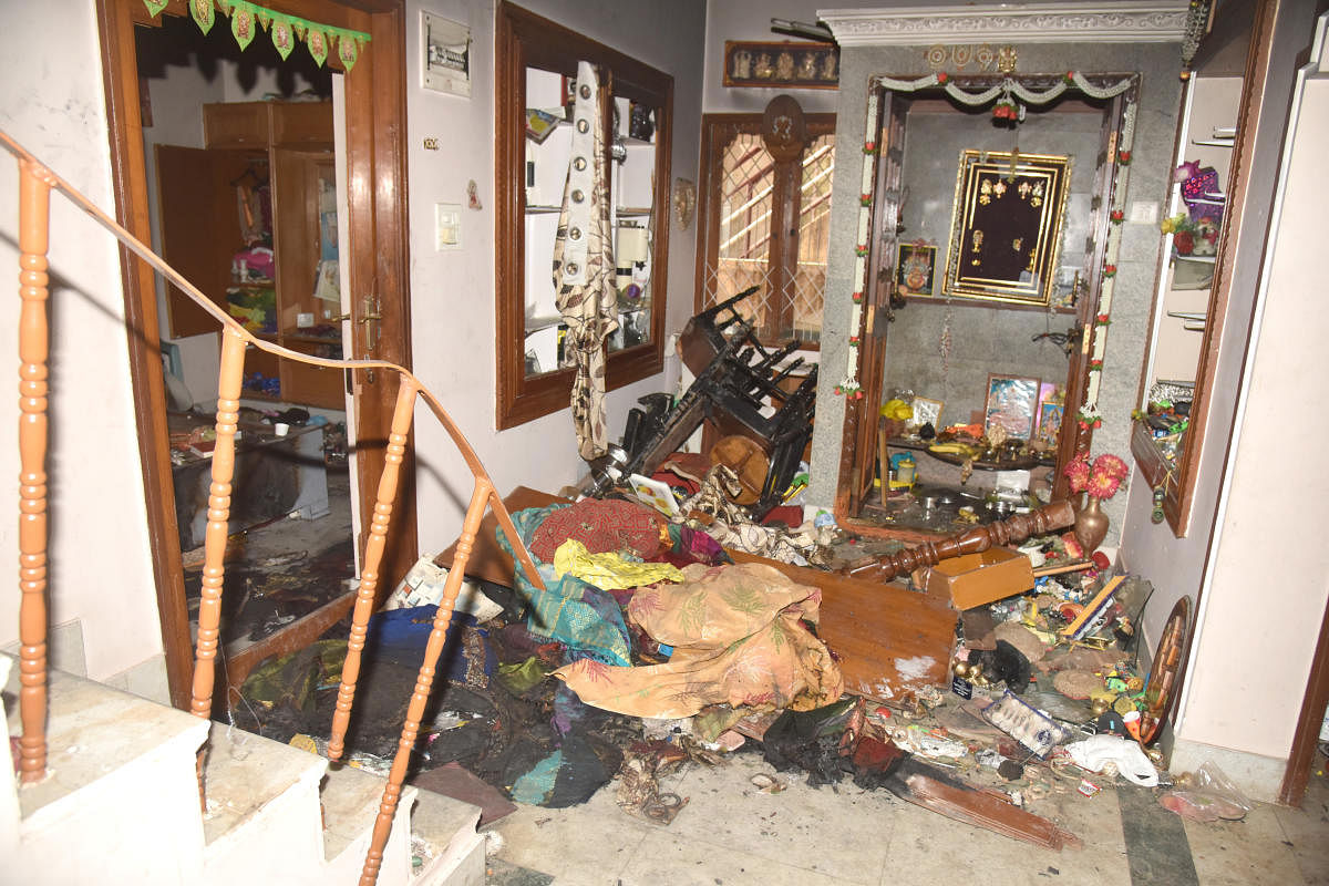The mob ransacked Jayanthi’s (inset)house. DH PHOTO/S K DINESH