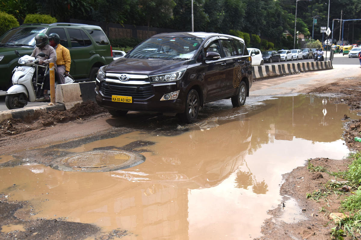 Rainwater stagnated on many roads. The picture shows the road opposite the gurdwara in Halasuru, Bengaluru. DH PHOTO/S K DINESH