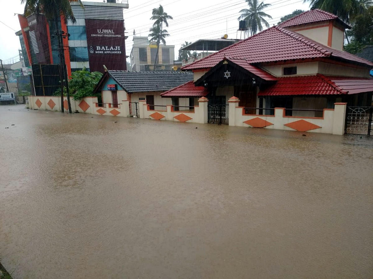 A waterlogged street in Udupi on Sunday. 
