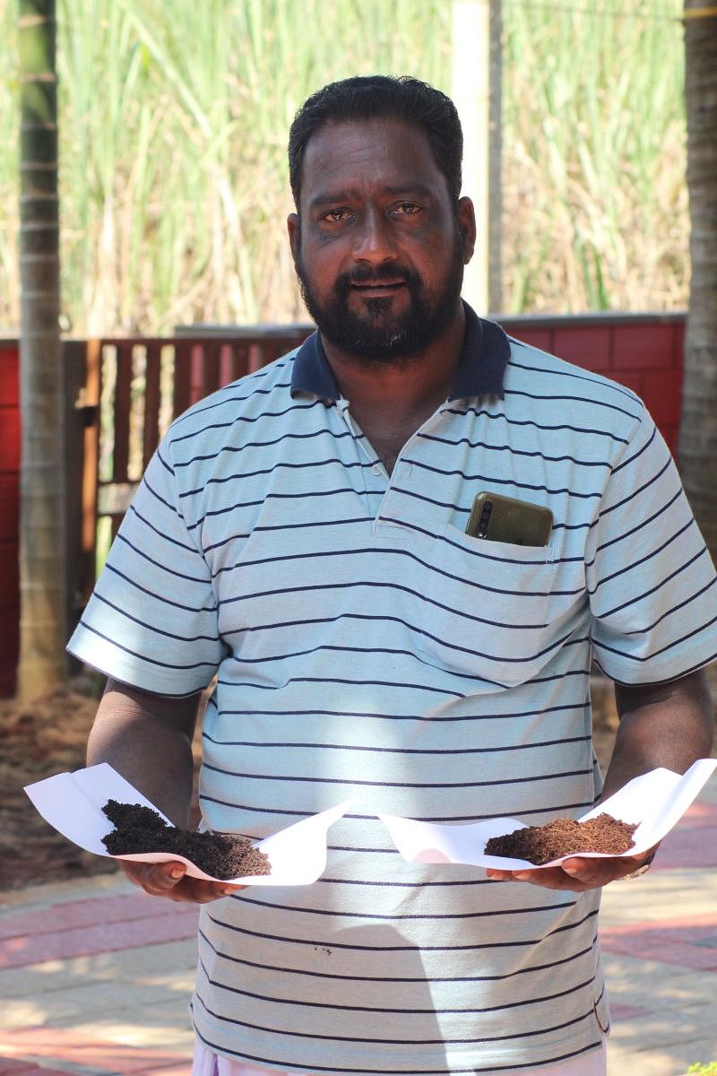 Satish Poojary poses with his homemade manure 