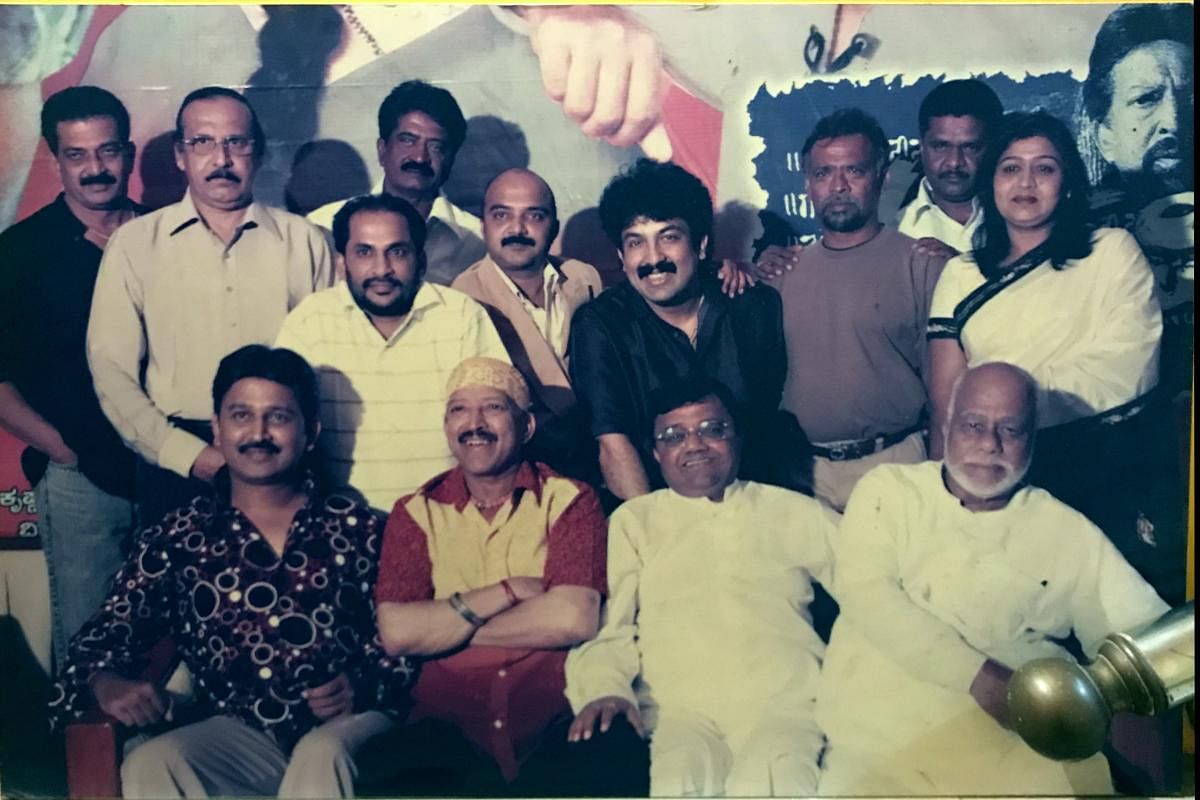 Gurukiran (standing centre, in dark-colored shirt) with the team of the hit film ‘Apthamitra’. Credit: Photo by Special Arrangement