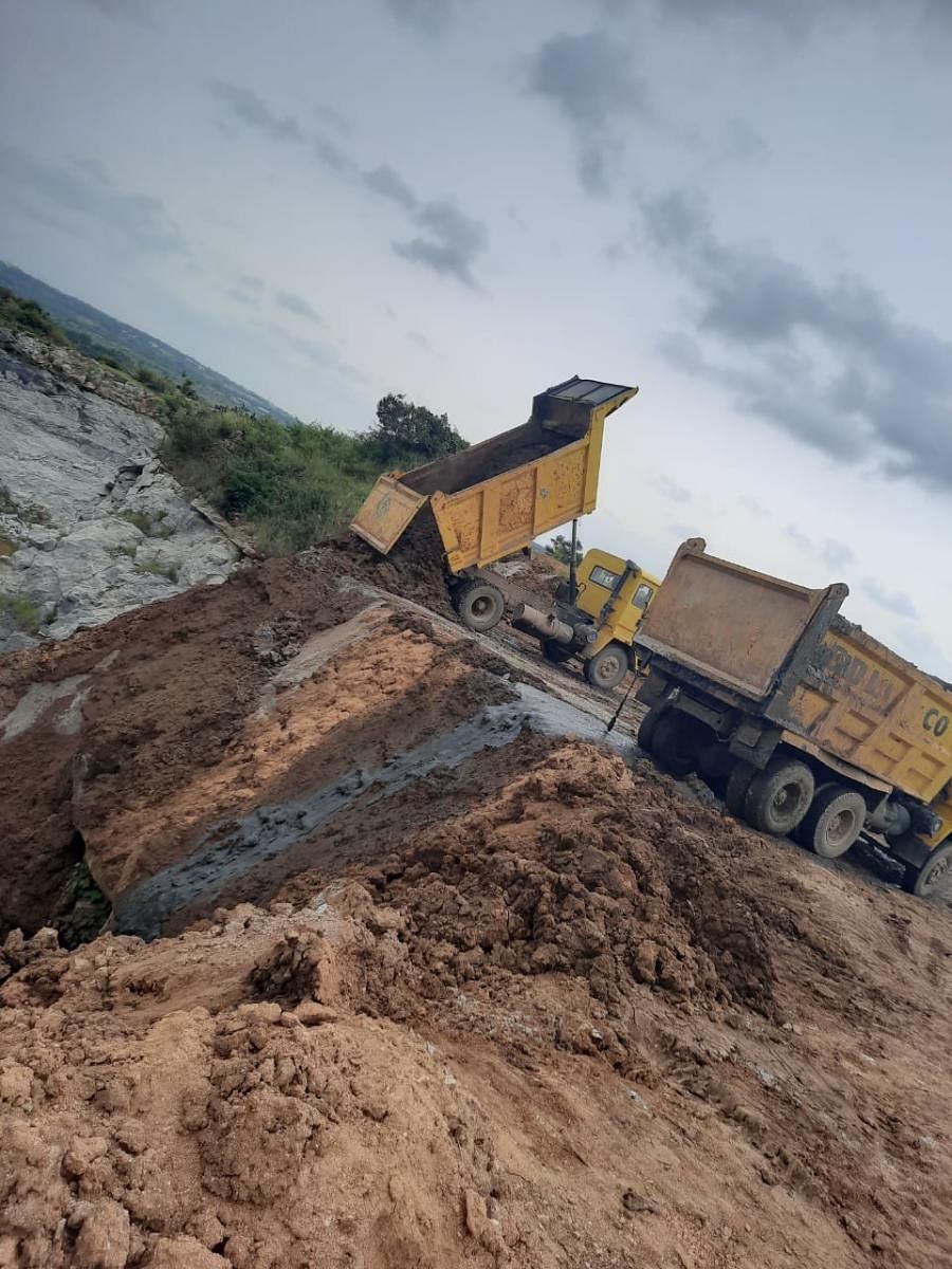 A truck dumping silt extracted from TG Halli reservoir into an abandoned quarry on the outskirts of Bengaluru.
