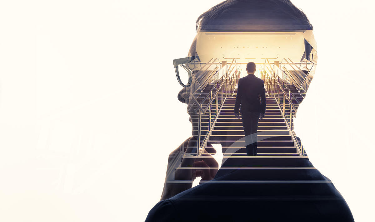 Double exposure of a businessman and stairs. Success of business concept.Images for Career page. Istock 