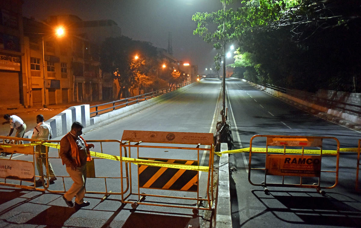 Police guard the entrance to the BGS flyover near KR Market. It's one of the many flyovers in Bengaluru traffic was banned during New Year's celebrations. DH PHOTO/ANUP RAGH T