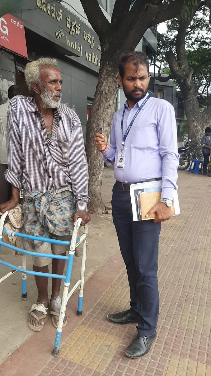 Satish Metri with an aged beneficiary. Photo by special arrangement
