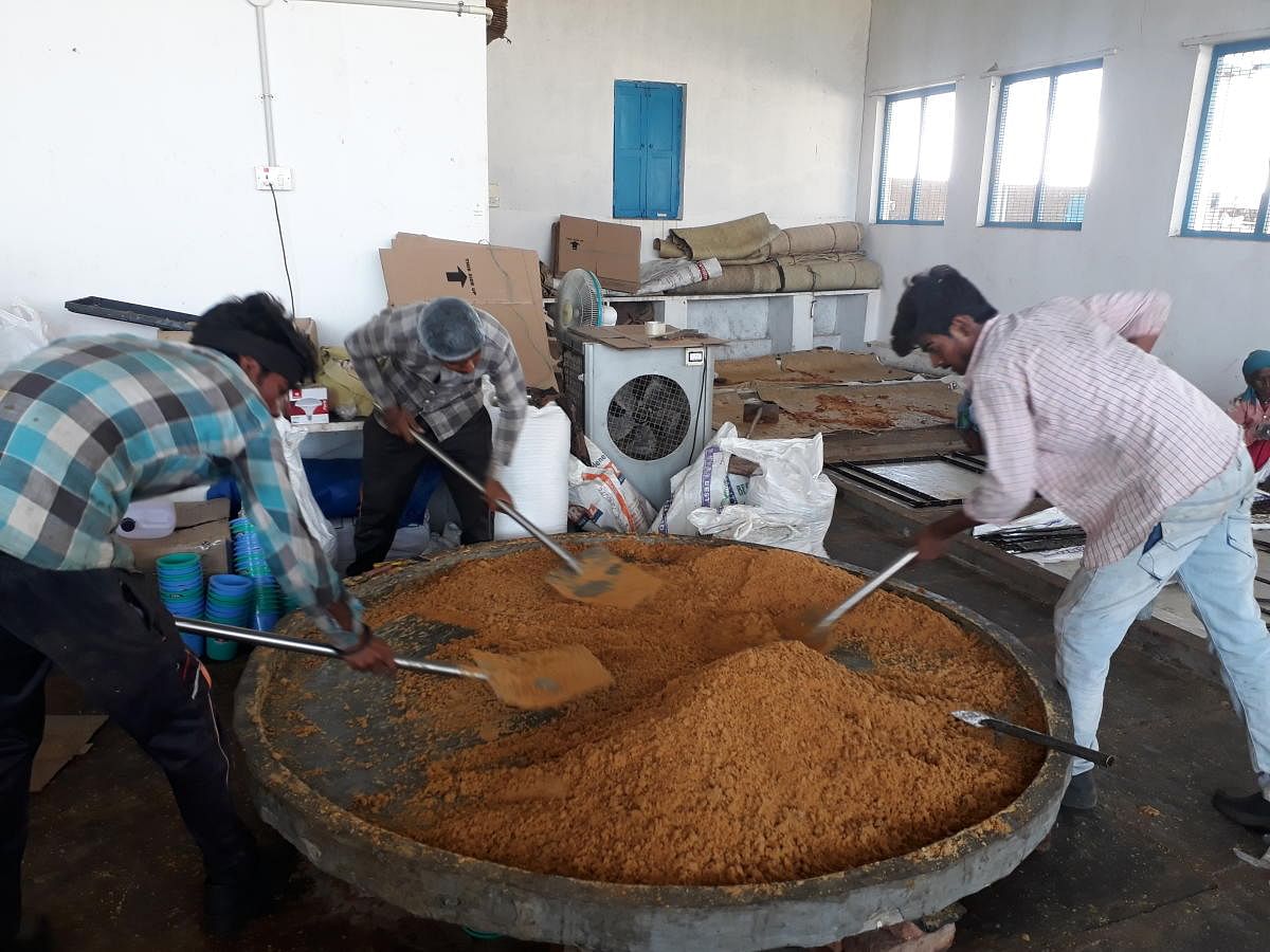 Workers prepare jaggery powder. Photo by Pramod Chitturi
