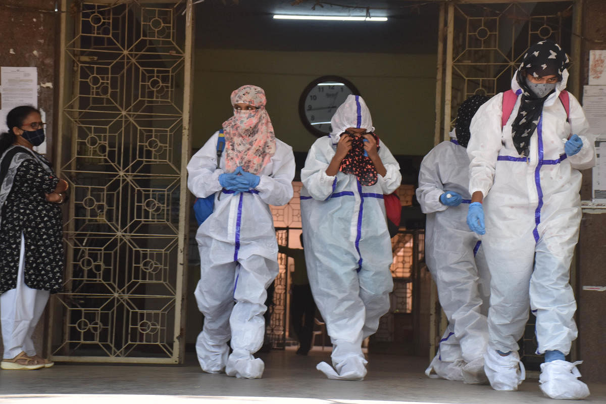 Covid suspected students at Maharani Cluster University appeared for annual exams wearing PPE kits. Later, the BBMP reported to the university that all four students tested negative for Covid-19
