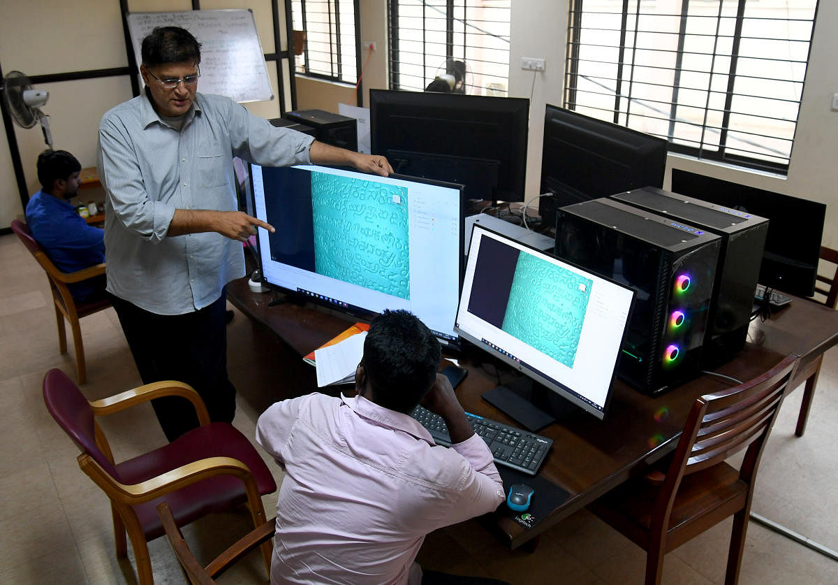 Uday and his team work on digitisation of inscription stones in Bengaluru on Saturday, April 10, 2021. DH PHOTO/PUSHKAR V