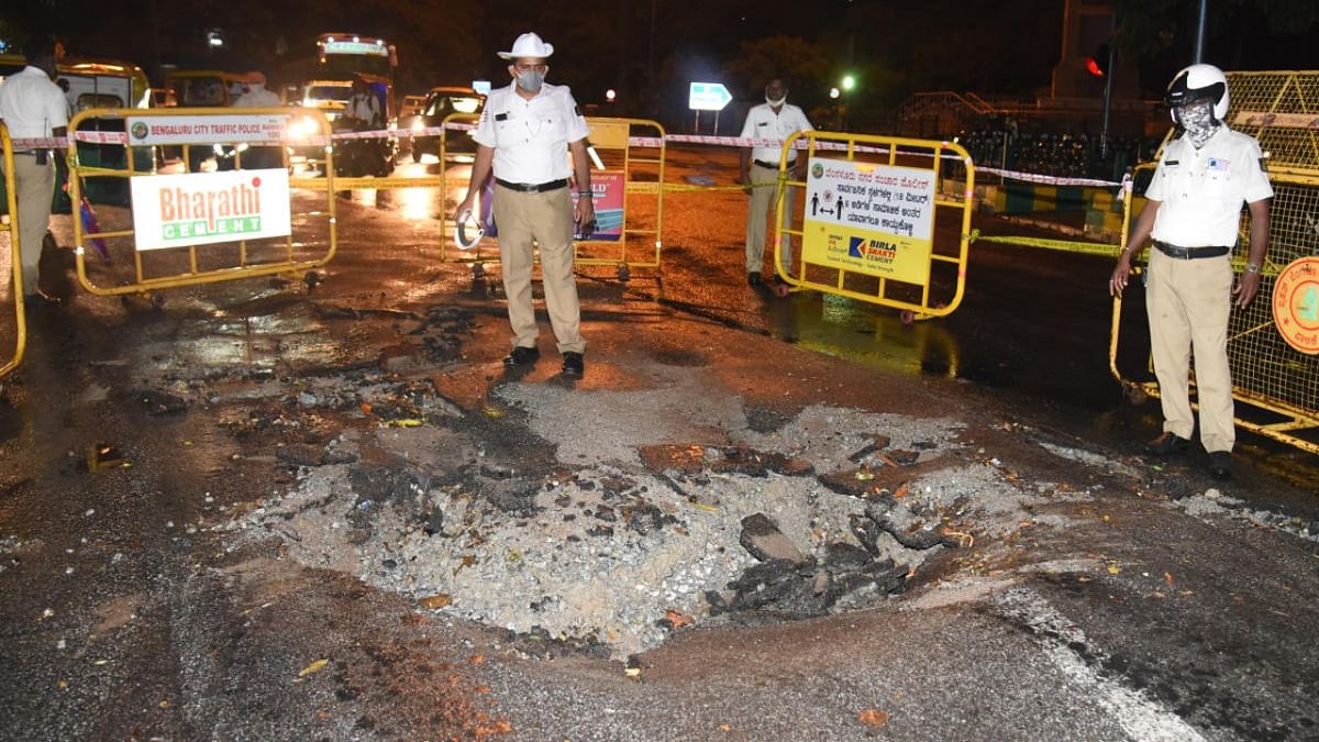 A portion of Hudson Road, central Bengaluru, caved in following the rain. Credit: DH Photo/SK Dinesh