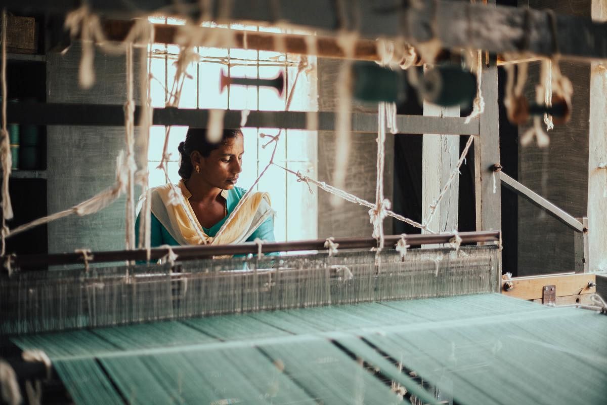 A weaver at work at Janapada Khadi.