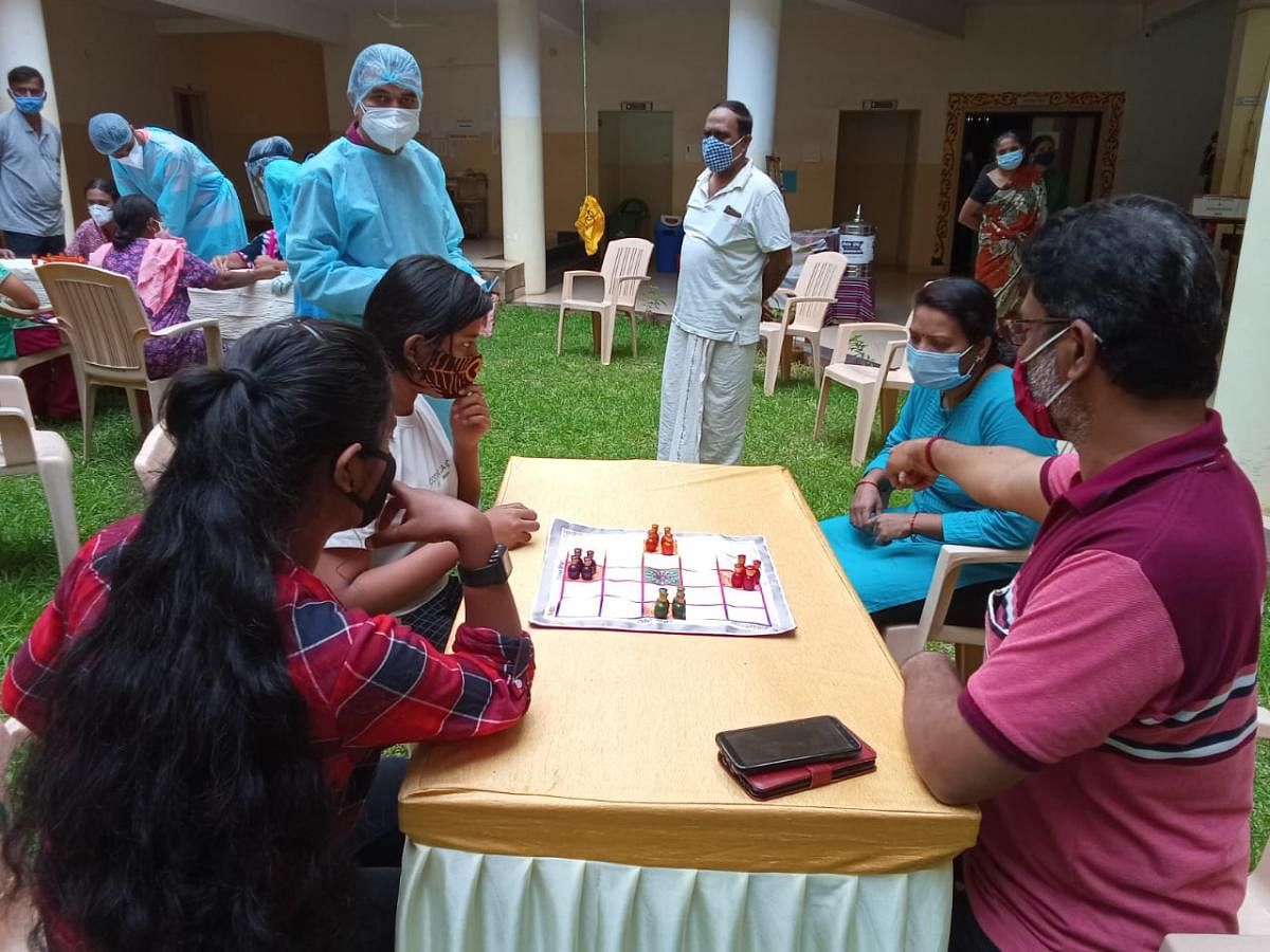 Covid patients play a traditional board game at a Covid care centre in Hubballi.