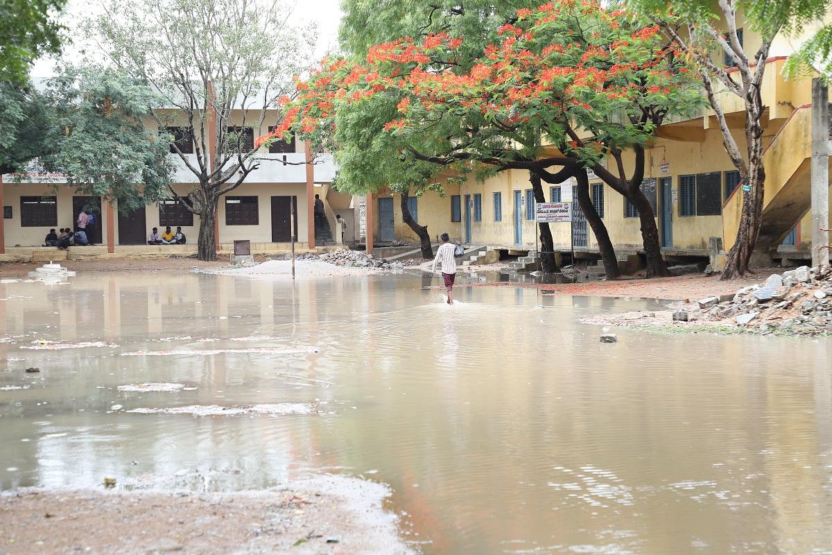 Water accumulated on the premises of the government school in Raichur. DH Photos 