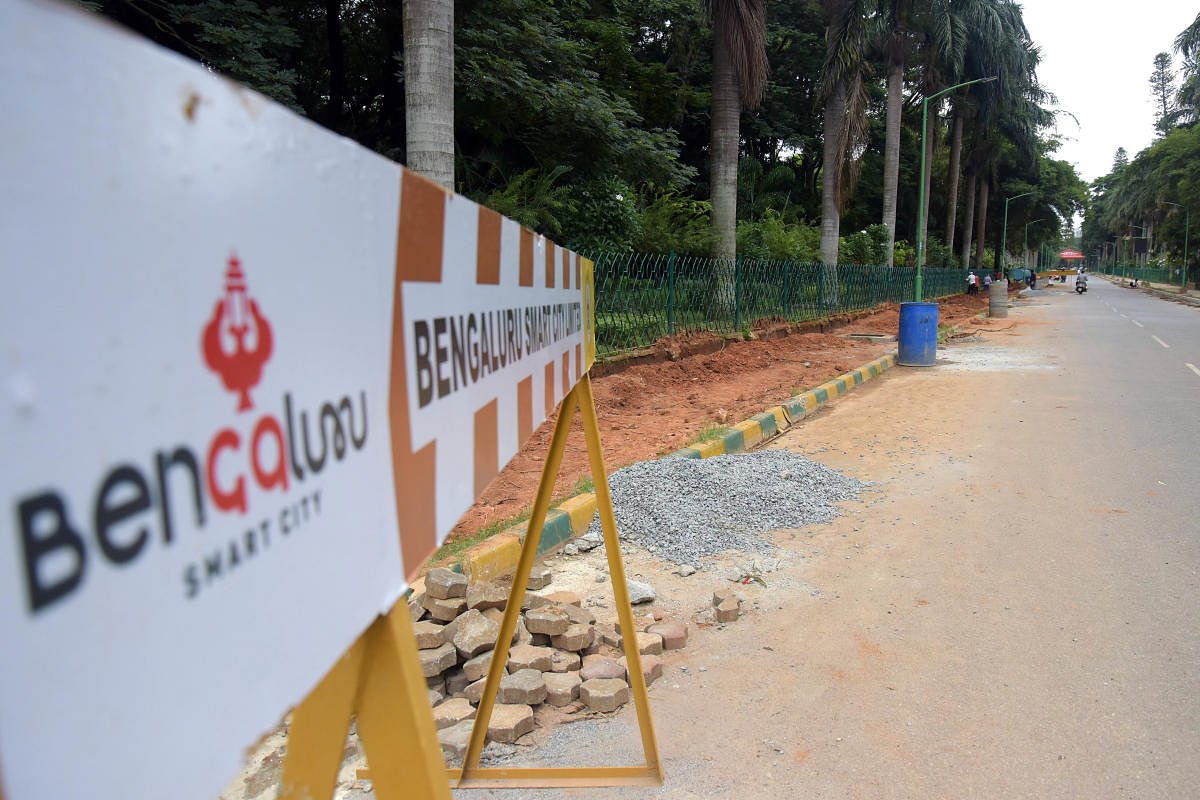 A Smart City barricade is seen in the backdrop of construction work at Cubbon Park, Bengaluru's premier green space, on July 9, 2021. Credit: DH file photo/Pushkar V