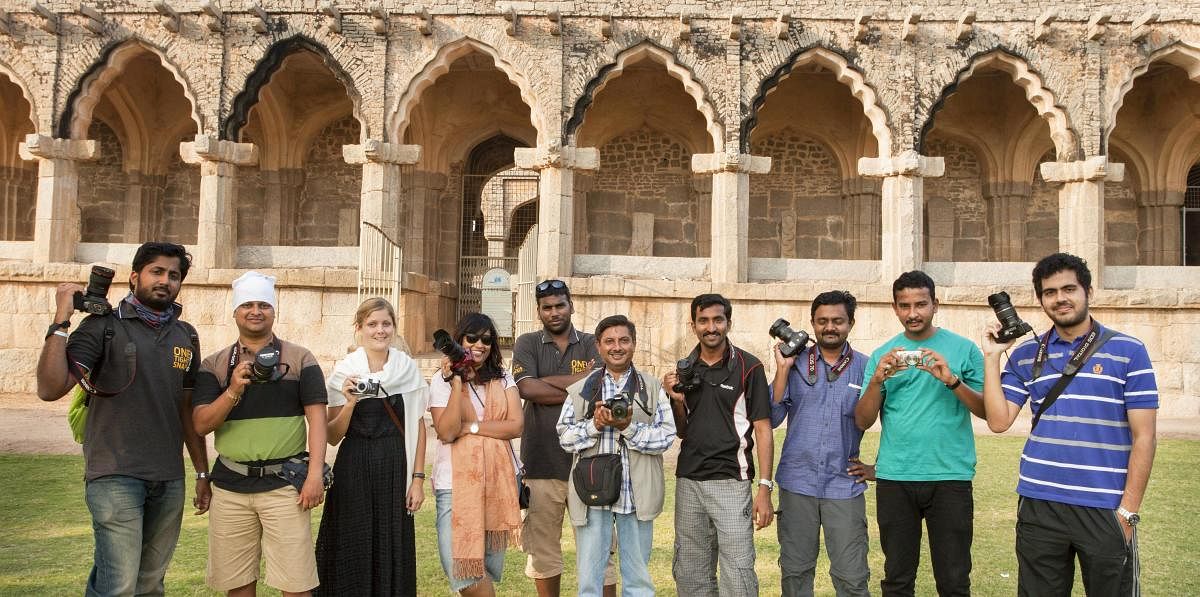 Praveen P (fifth from left), founder of Focus Photography Club, at the Elephant Stables during a photo tour of Hampi.