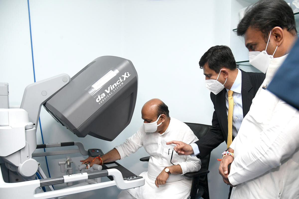Chief Minister Basavaraj Bommai looks at the Robotic Operation Theatre after its inauguration at the Kidwai Memorial Institute of Oncology Cancer Research and Training Centre (KMIO) in Bengaluru on Monday, 23 August 2021. Dr K Sudhakar, Health and Family