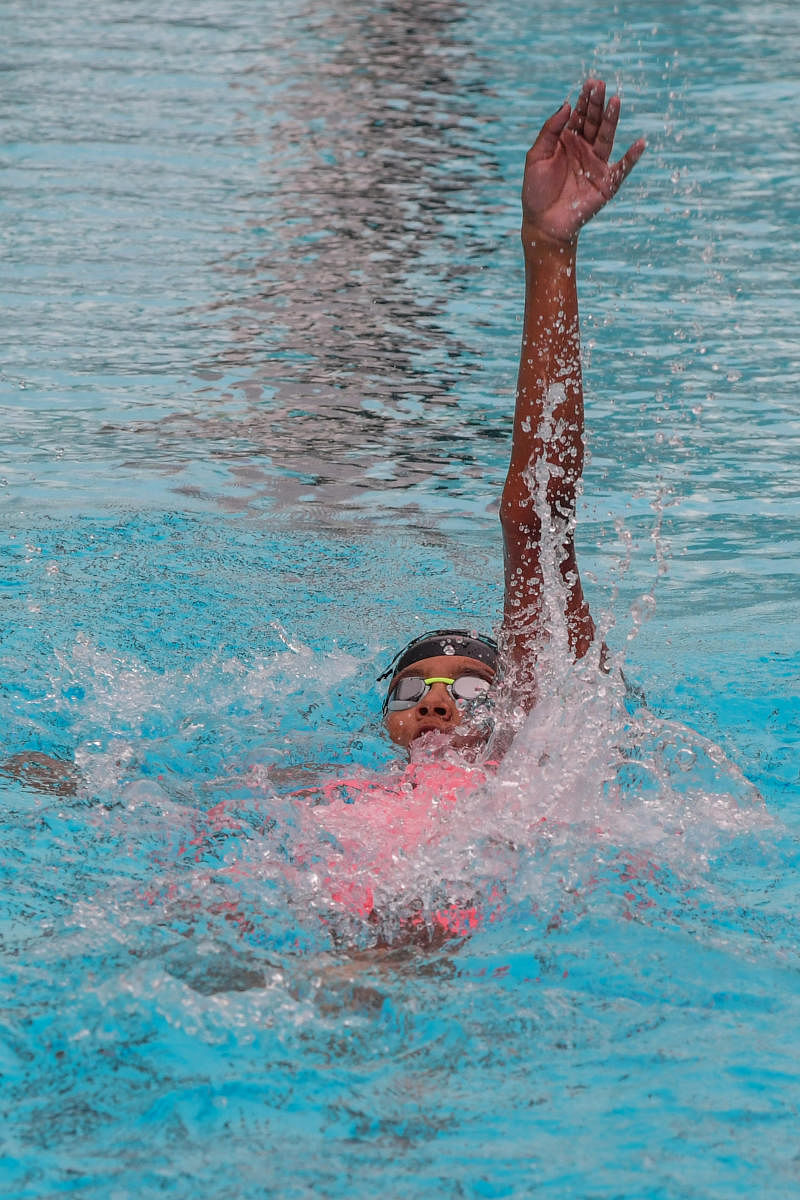 Ridhima Veerendra Kumar of Basavanagudi Aquatic centrer in Girls group two 200m backstroke swimming computation in State Sub Junior, Junior and Senior Aquatic Championships 2021-22 organised by Karnataka Swimming Association at Corporation Swimming Pool,